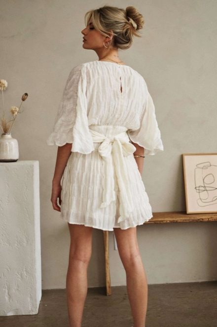 V Neck Romper with Flowing Sleeves and Belted waist.