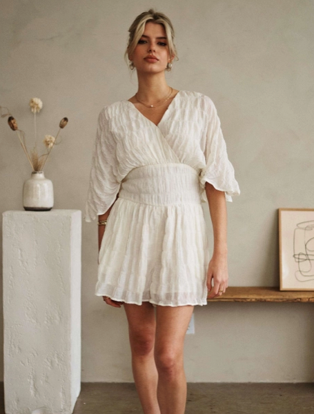 V Neck Romper with Flowing Sleeves and Belted waist.